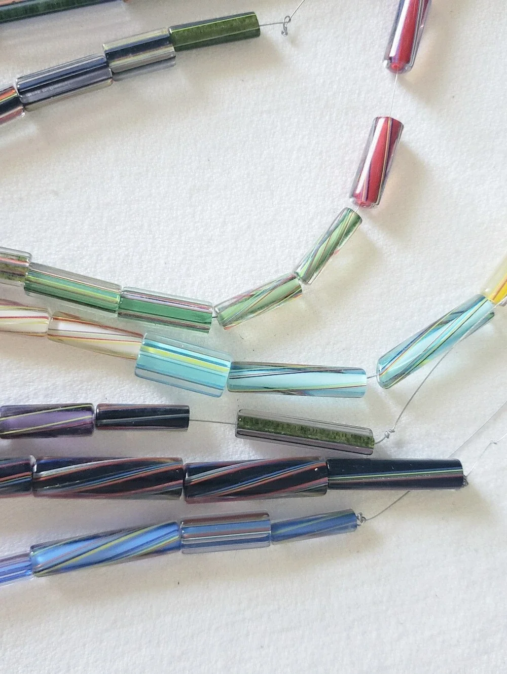 80 hand-drawn glass tube beads